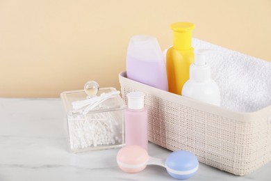 Photo of Different baby accessories on table against beige background