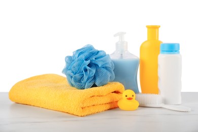 Photo of Different baby accessories on table against white background