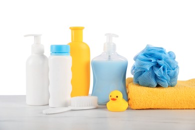 Photo of Different baby accessories on table against white background