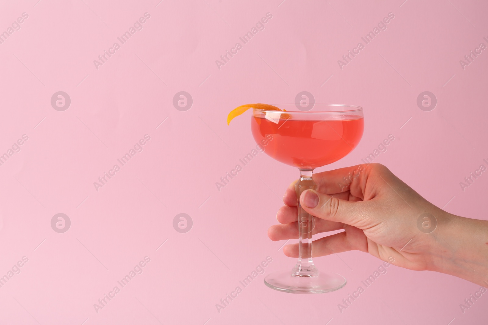 Woman with martini cocktail on pink background, closeup. Space for text Photo of Woman with martini cocktail on pink background, closeup. Space for text