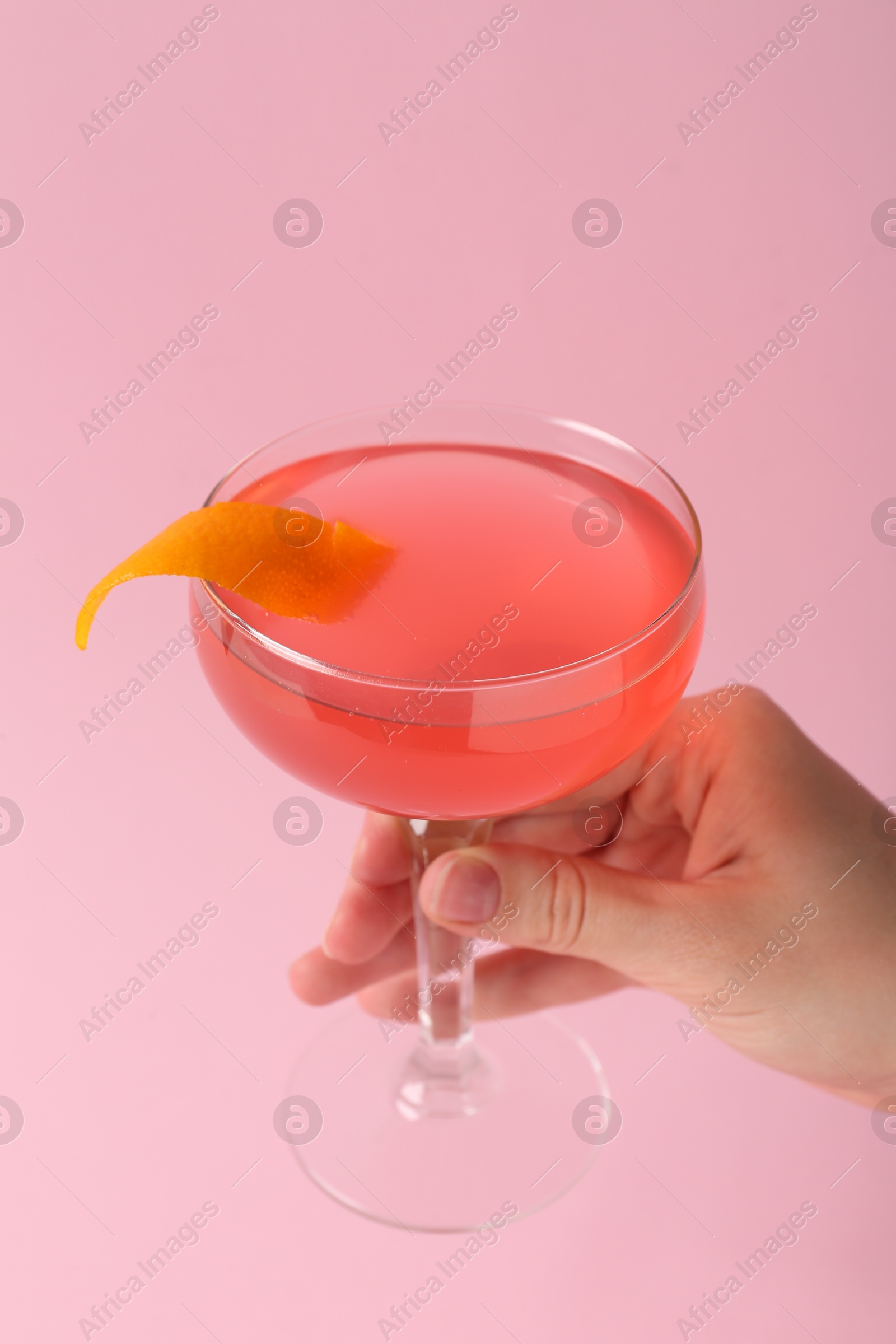 Woman with martini cocktail on pink background, closeup Photo of Woman with martini cocktail on pink background, closeup