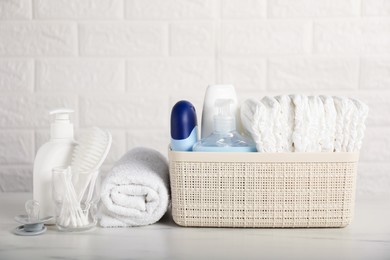 Photo of Many different baby accessories on table near brick wall