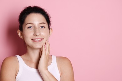 Photo of Portrait of smiling woman after dental aligners treatment on pink background. Space for text