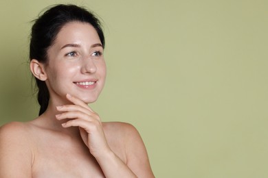 Photo of Smiling woman after dental aligners treatment on green background. Space for text