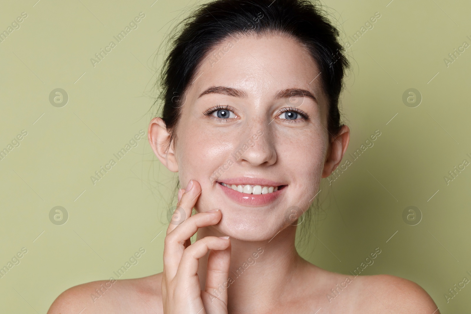 Portrait of smiling woman after dental aligners treatment on green background, closeup Photo of Portrait of smiling woman after dental aligners treatment on green background, closeup