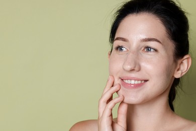 Photo of Smiling woman after dental aligners treatment on green background, closeup. Space for text