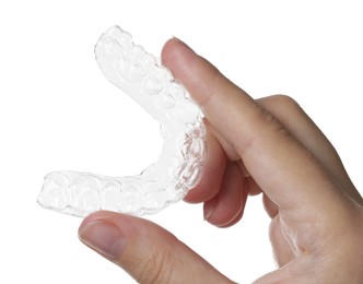 Photo of Woman with dental aligner on white background, closeup