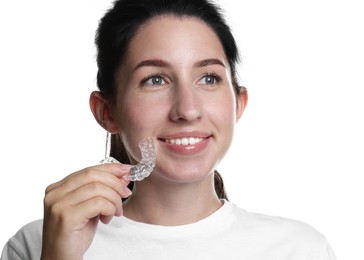 Photo of Smiling woman with dental aligner on white background, closeup