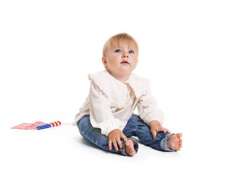 Photo of Cute little child with flag of USA on white background