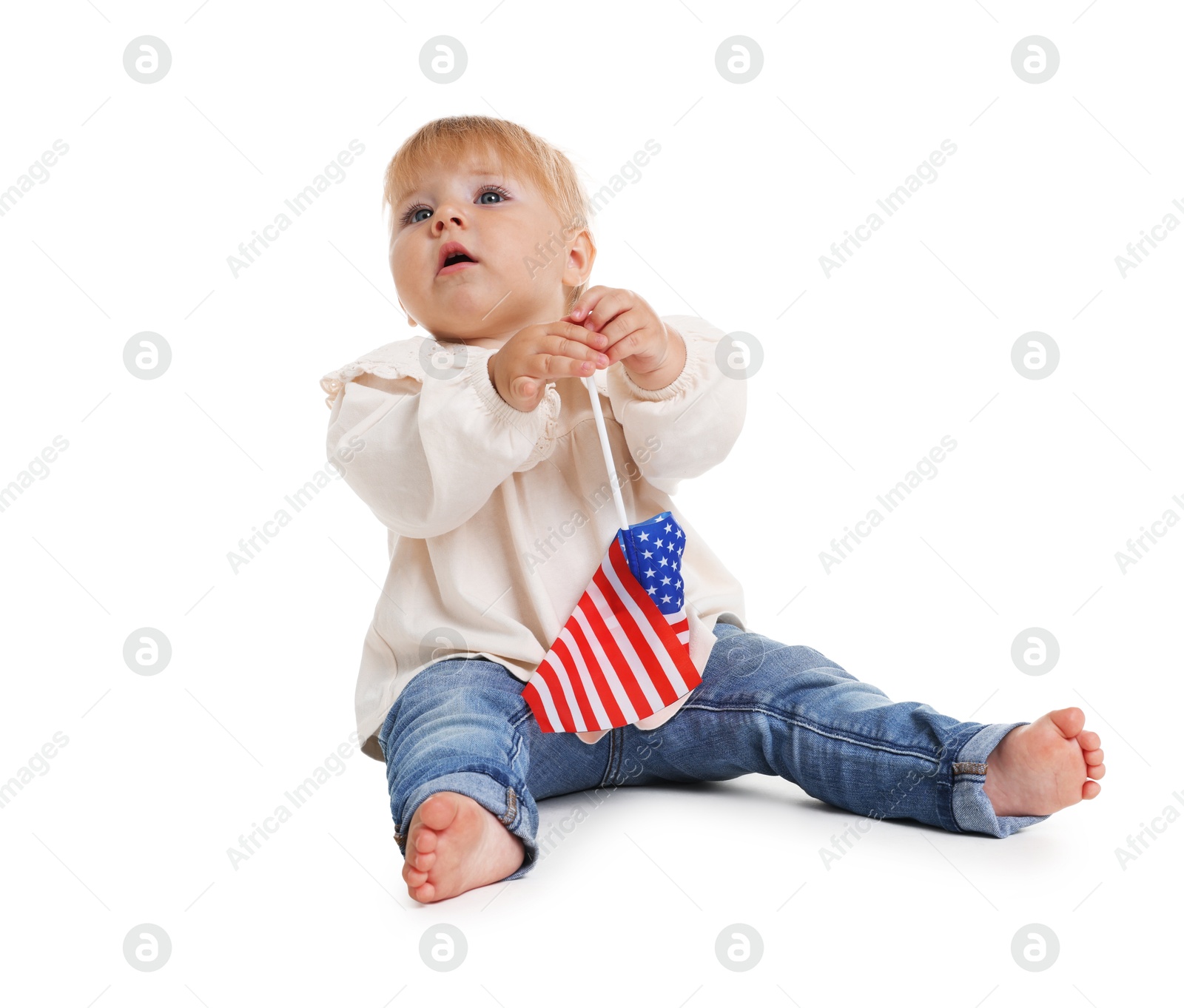 Photo of Cute little child with flag of USA on white background
