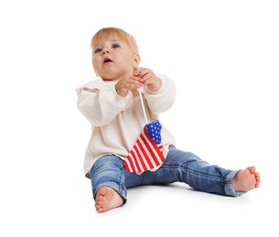 Photo of Cute little child with flag of USA on white background