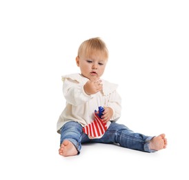Photo of Cute little child with flag of USA on white background
