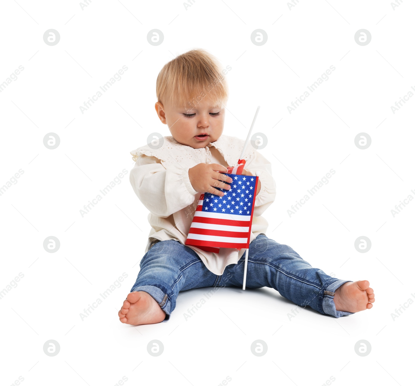 Photo of Cute little child with flag of USA on white background
