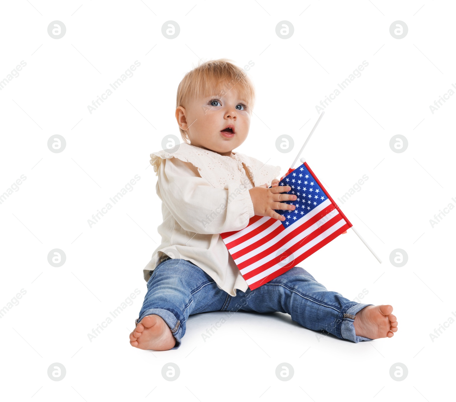 Photo of Cute little child with flag of USA on white background