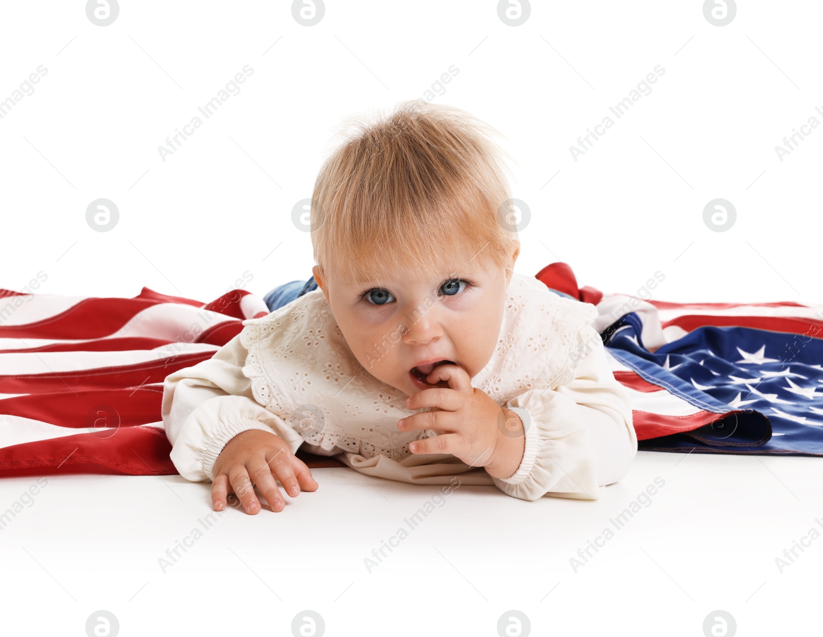 Photo of Cute little child with flag of USA on white background
