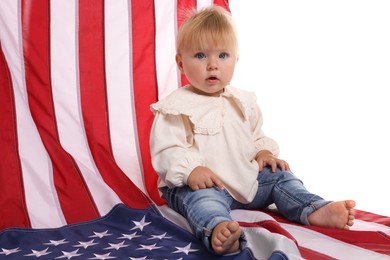 Photo of Cute little child with flag of USA on white background