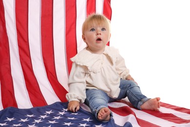 Photo of Cute little child with flag of USA on white background