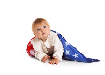 Photo of Cute little child with flag of USA on white background