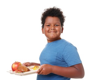 Photo of Little boy with tray of tasty food on white background