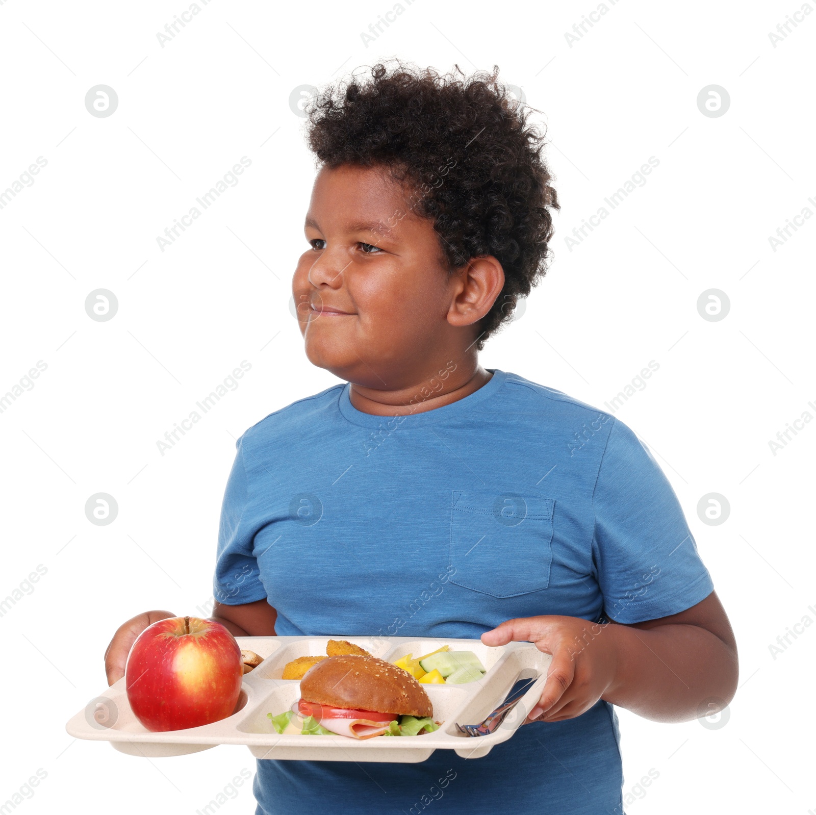 Little boy with tray of tasty food on white background Photo of Little boy with tray of tasty food on white background