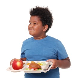 Photo of Little boy with tray of tasty food on white background
