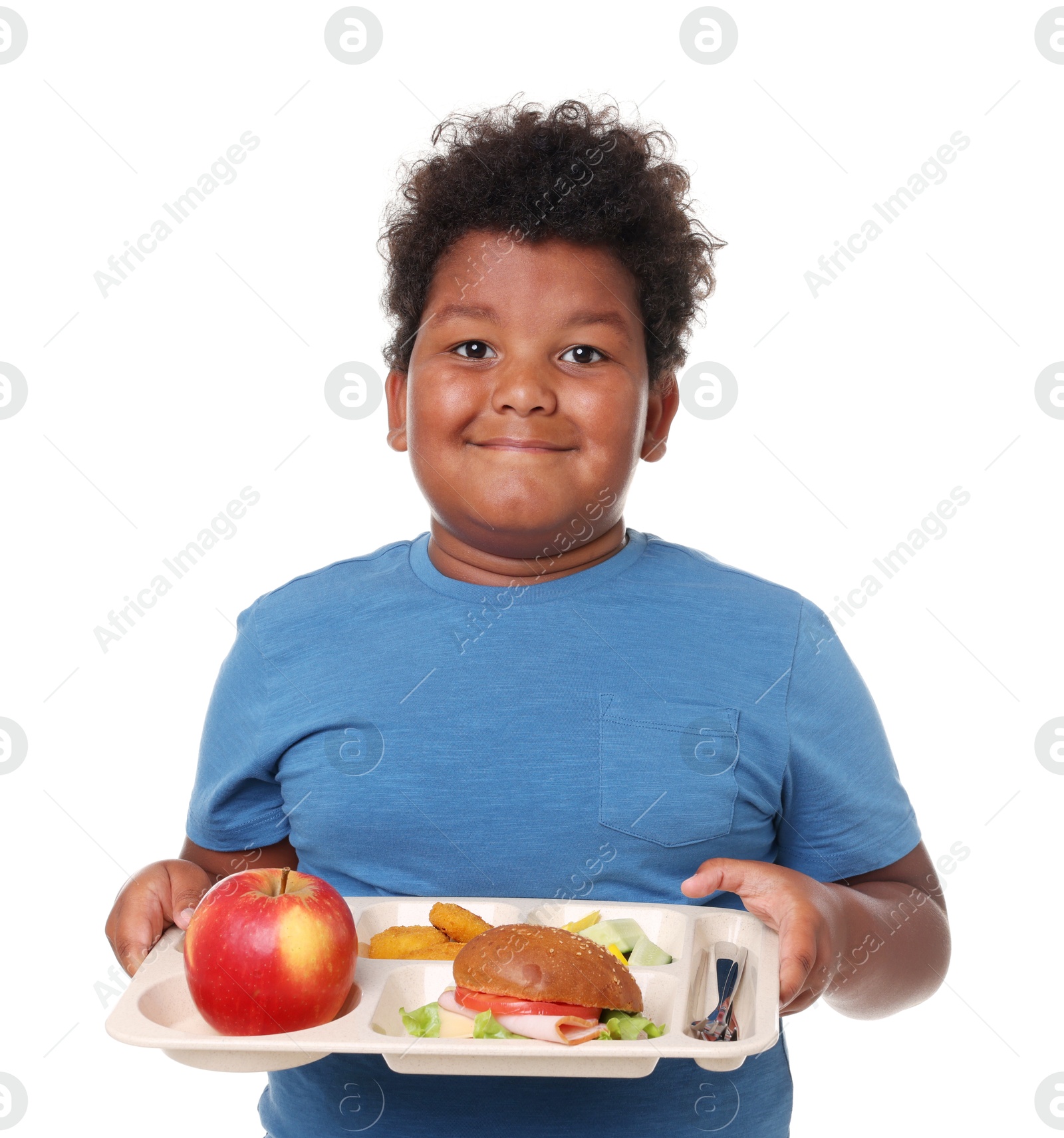 Little boy with tray of tasty food on white background Photo of Little boy with tray of tasty food on white background