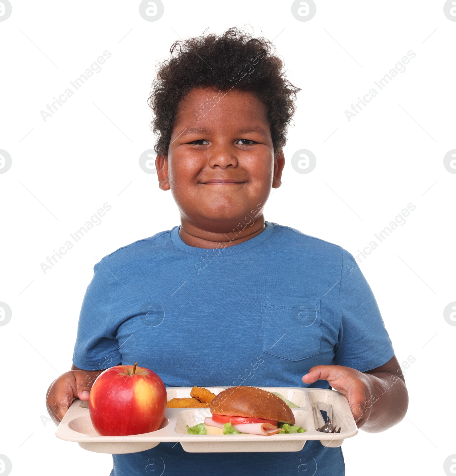 Little boy with tray of tasty food on white background Photo of Little boy with tray of tasty food on white background