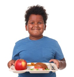 Photo of Little boy with tray of tasty food on white background