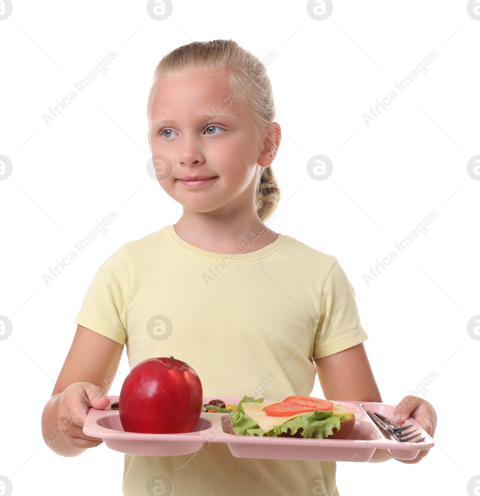 Little girl with tray of tasty food on white background Photo of Little girl with tray of tasty food on white background