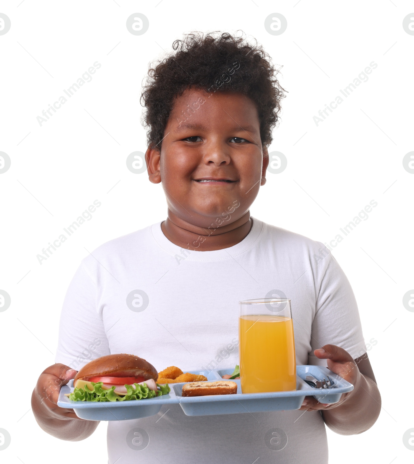 Little boy with tray of tasty food on white background Photo of Little boy with tray of tasty food on white background