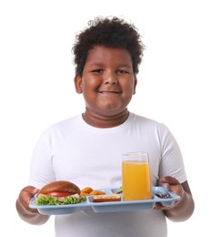 Photo of Little boy with tray of tasty food on white background