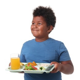 Photo of Little boy with tray of tasty food on white background