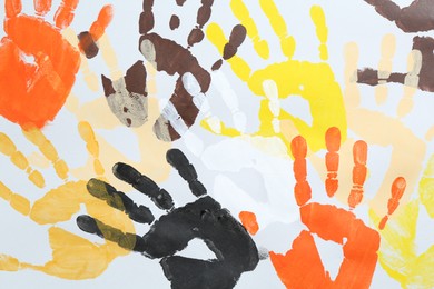 Photo of Tolerance concept. Colorful handprints on white background, flat lay