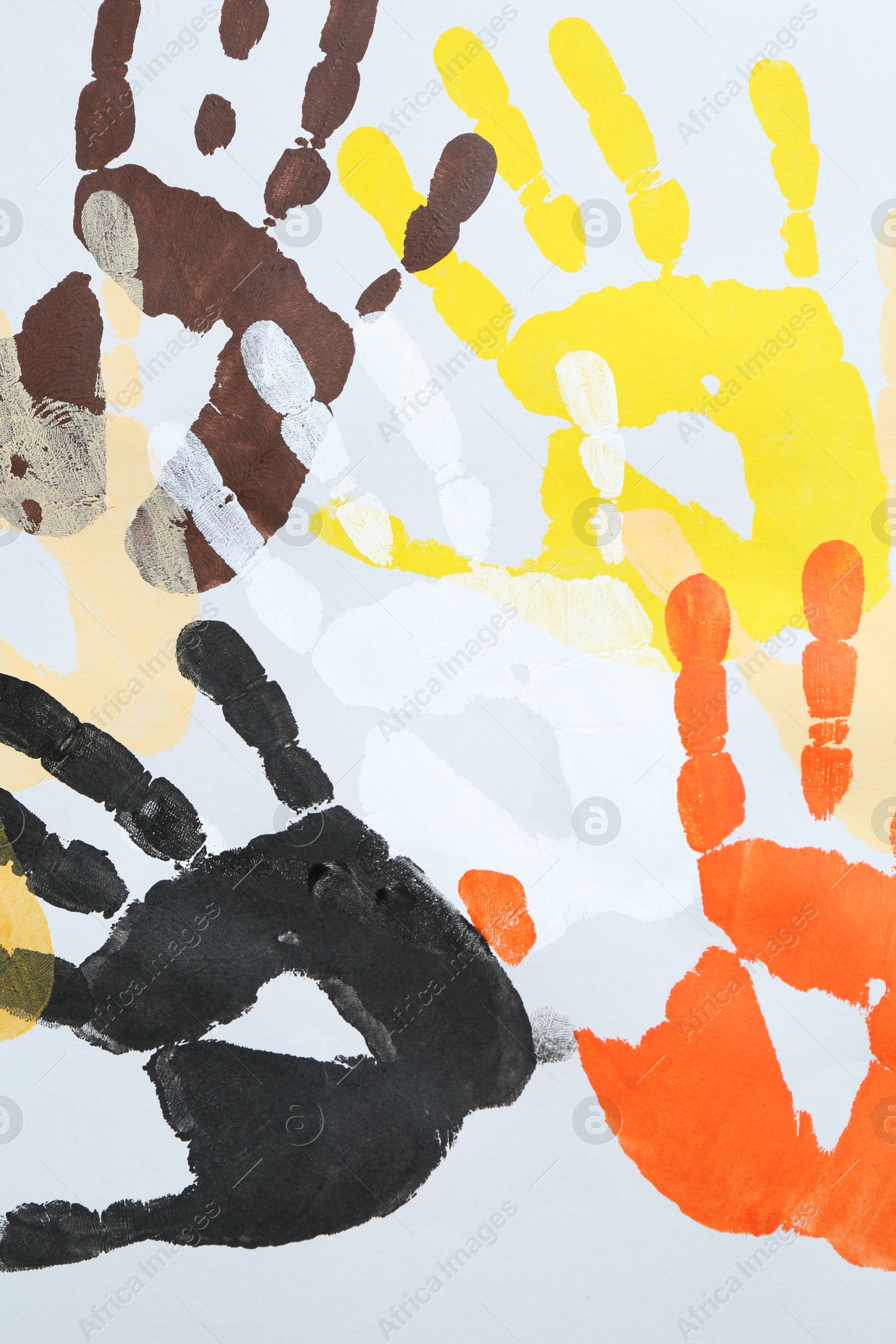Tolerance concept. Colorful handprints on white background, flat lay Photo of Tolerance concept. Colorful handprints on white background, flat lay