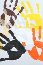 Photo of Tolerance concept. Colorful handprints on white background, flat lay