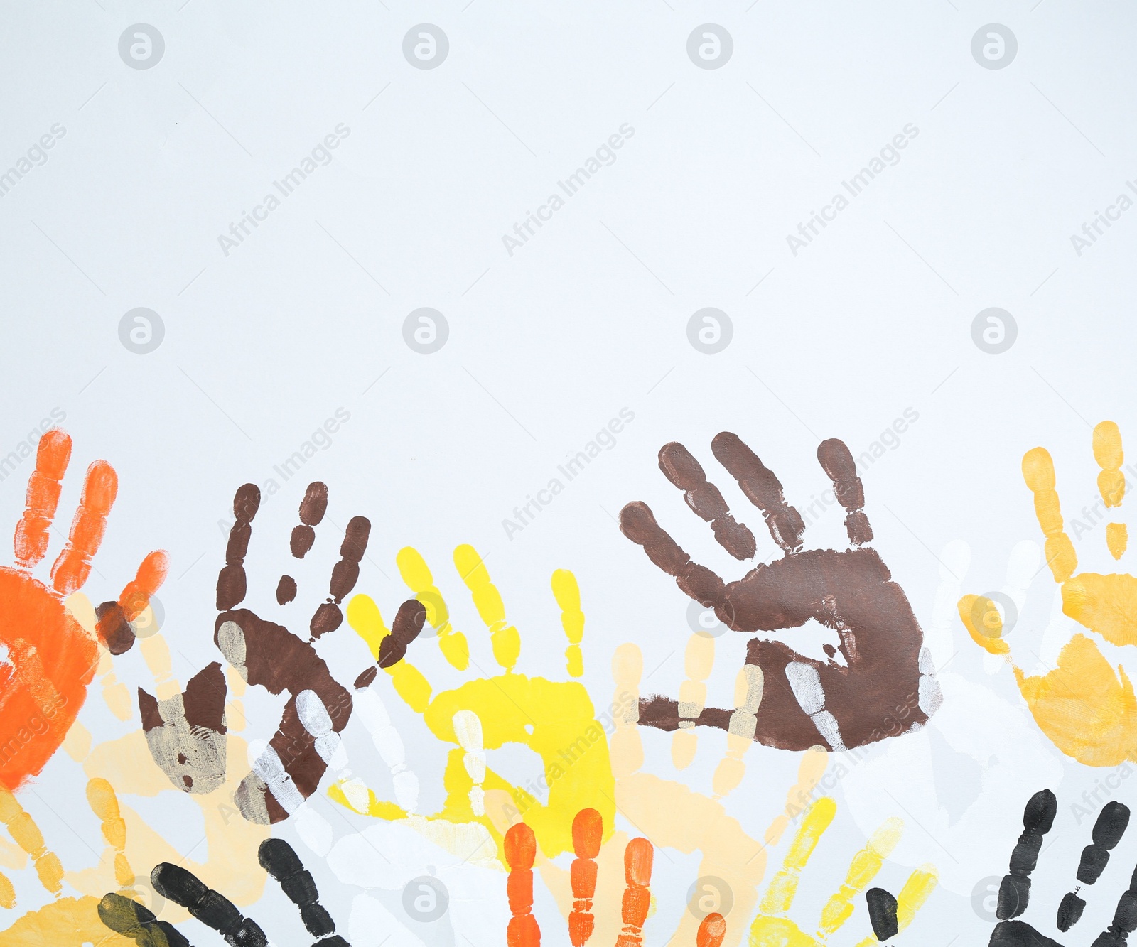 Tolerance concept. Colorful handprints on white background, flat lay. Space for text Photo of Tolerance concept. Colorful handprints on white background, flat lay. Space for text