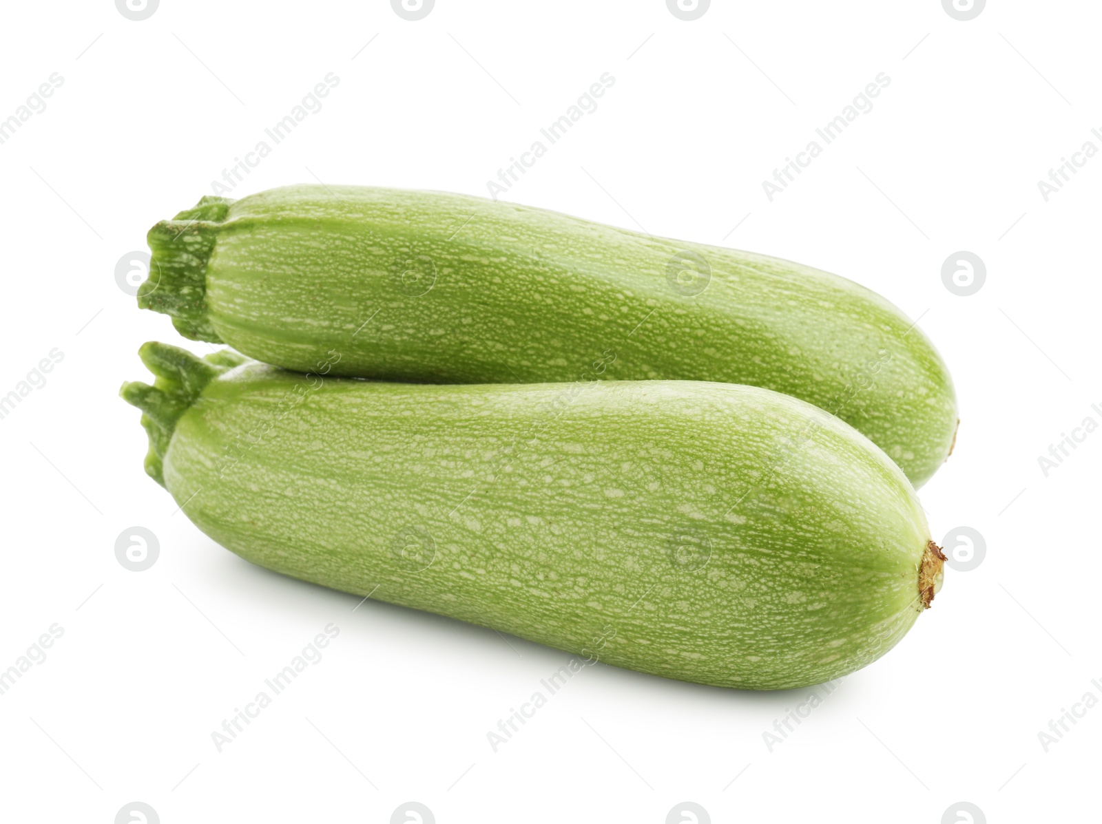Two fresh ripe zucchinis isolated on white Photo of Two fresh ripe zucchinis isolated on white