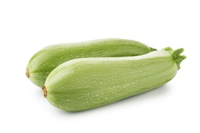 Photo of Two fresh ripe zucchinis isolated on white