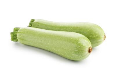 Photo of Two fresh ripe zucchinis isolated on white