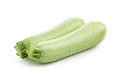Photo of Two fresh ripe zucchinis isolated on white