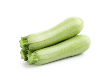 Photo of Three fresh ripe zucchinis isolated on white