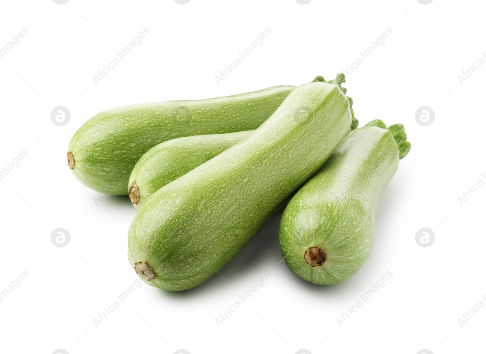 Many fresh ripe zucchinis isolated on white Photo of Many fresh ripe zucchinis isolated on white