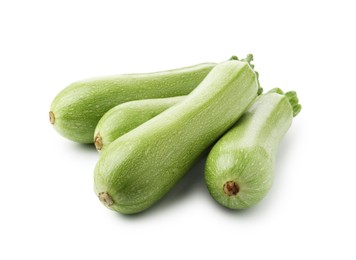 Photo of Many fresh ripe zucchinis isolated on white