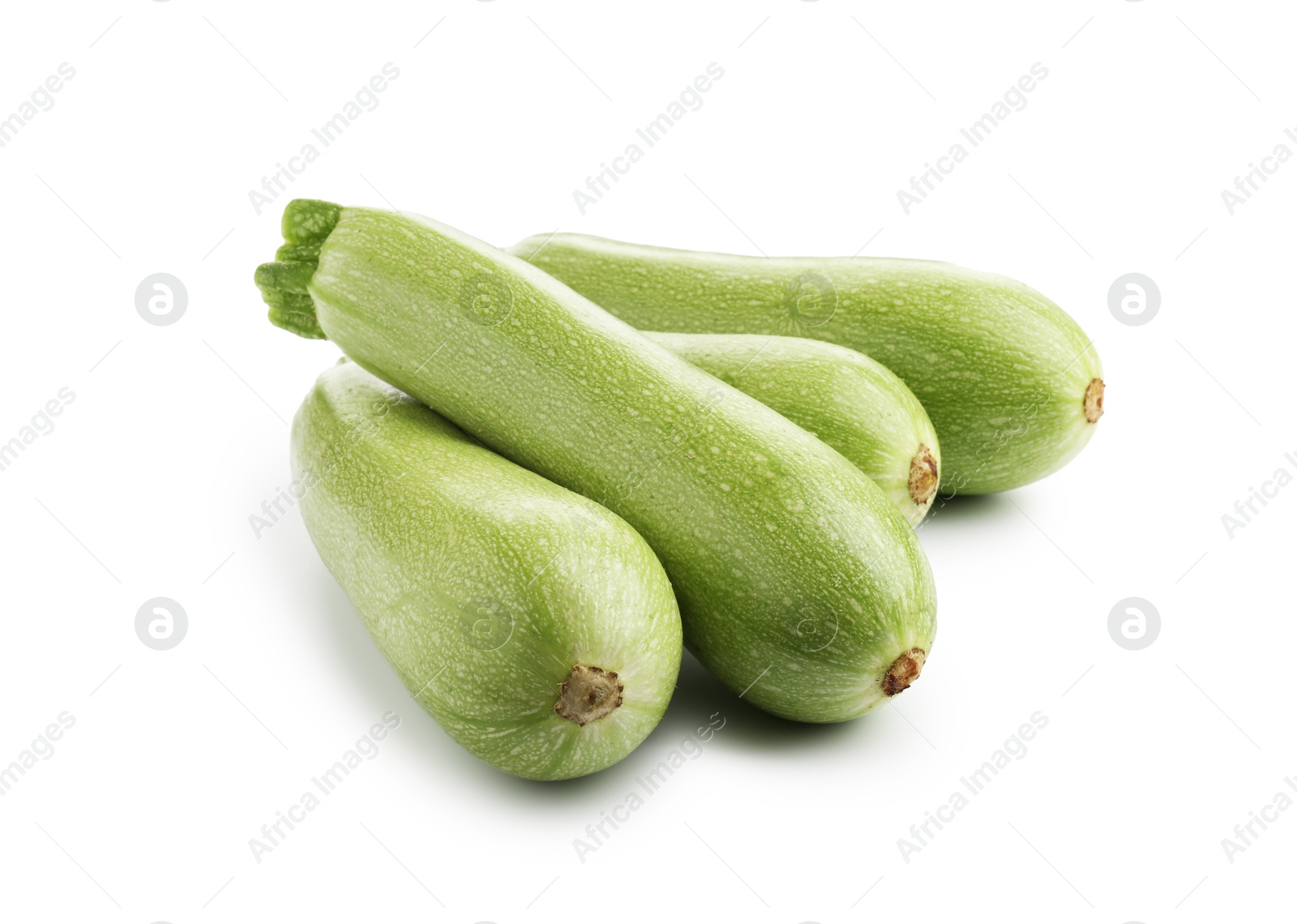 Photo of Many fresh ripe zucchinis isolated on white