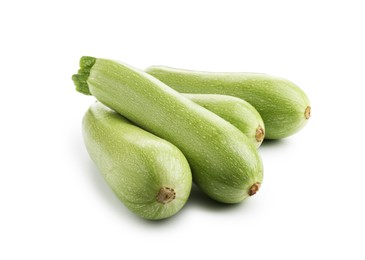 Photo of Many fresh ripe zucchinis isolated on white