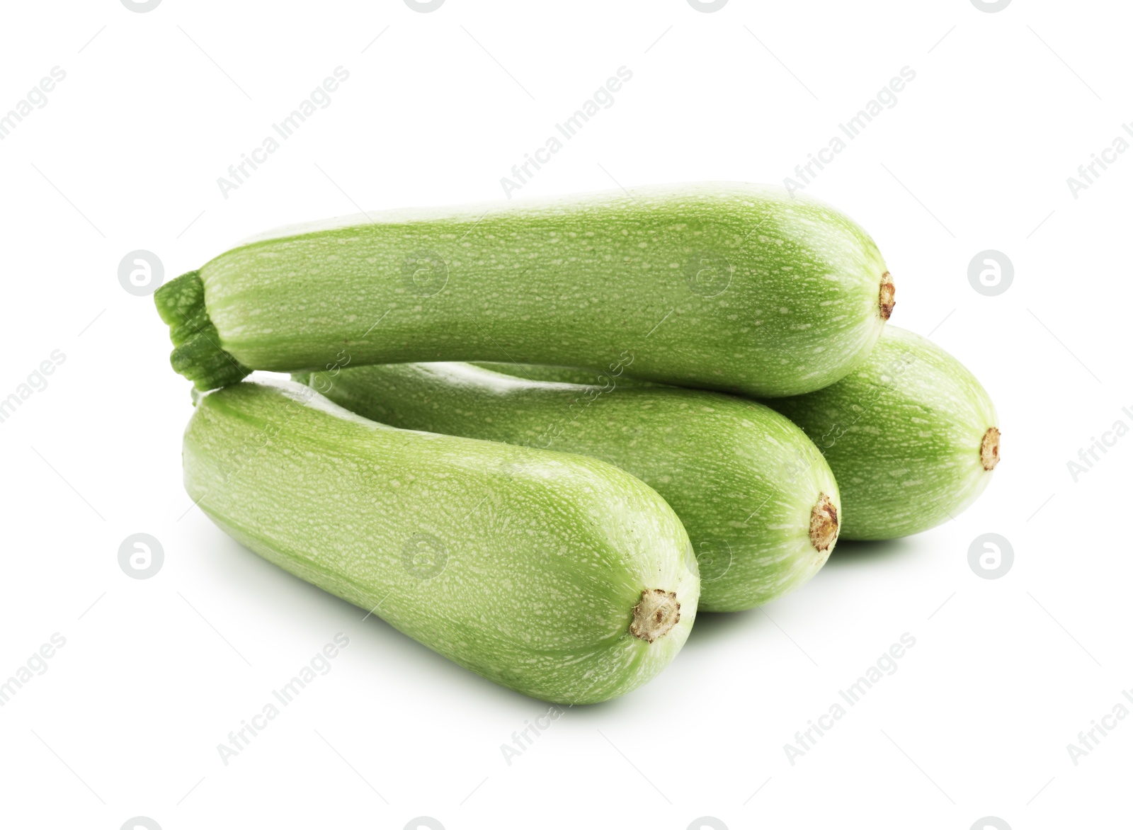 Photo of Many fresh ripe zucchinis isolated on white