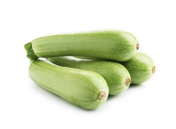 Photo of Many fresh ripe zucchinis isolated on white