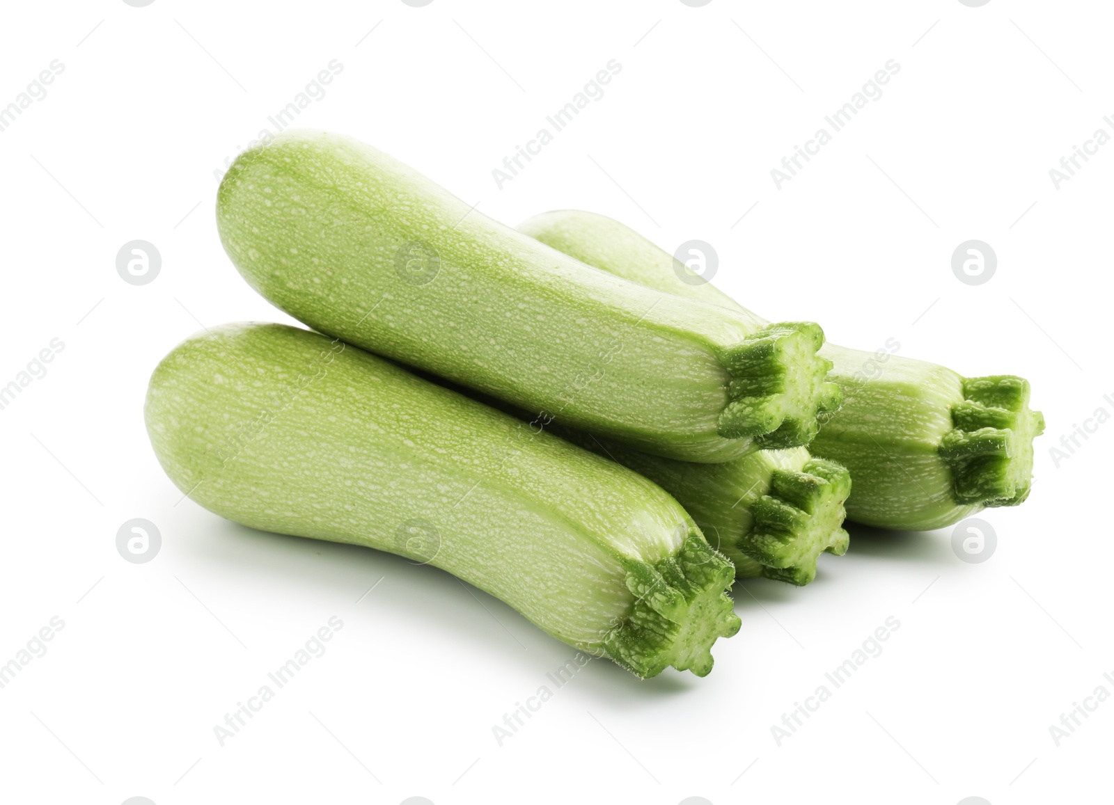 Photo of Many fresh ripe zucchinis isolated on white