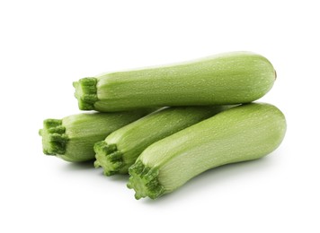 Photo of Many fresh ripe zucchinis isolated on white