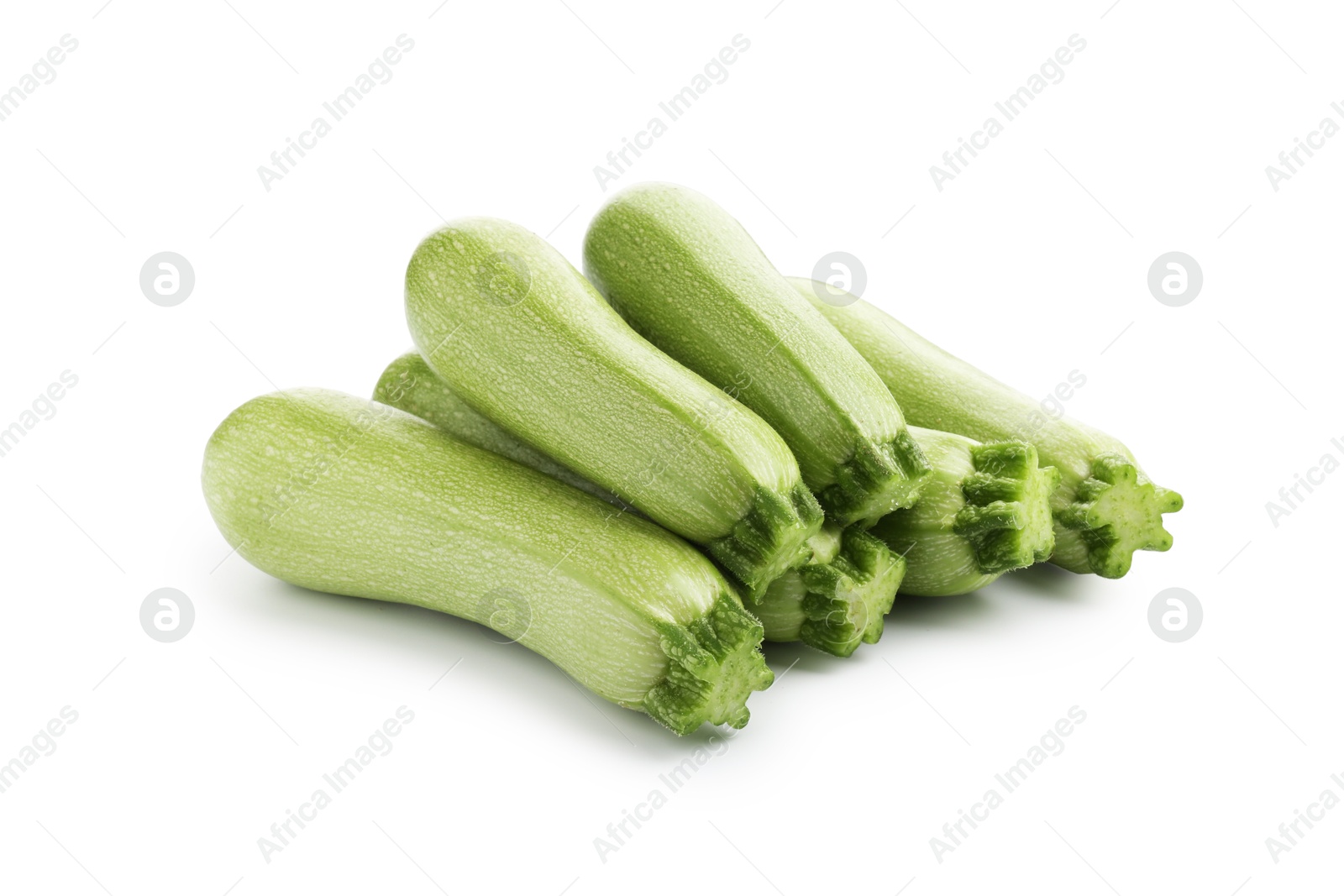 Many fresh ripe zucchinis isolated on white Photo of Many fresh ripe zucchinis isolated on white